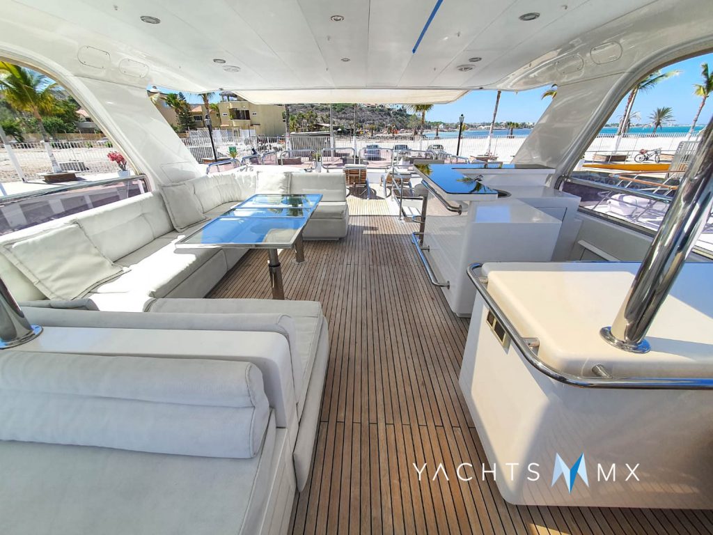 Horizon 84 yacht charter La Paz - flybridge dining and sun lounge