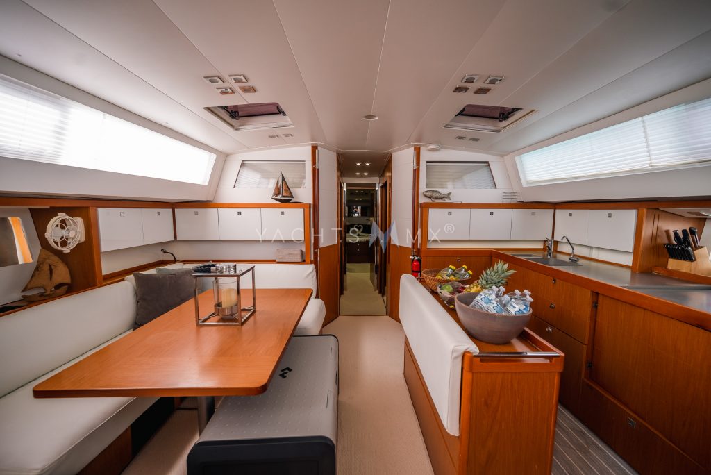 Beneteau 58 yacht charter La Paz - main salon and galley photo 01