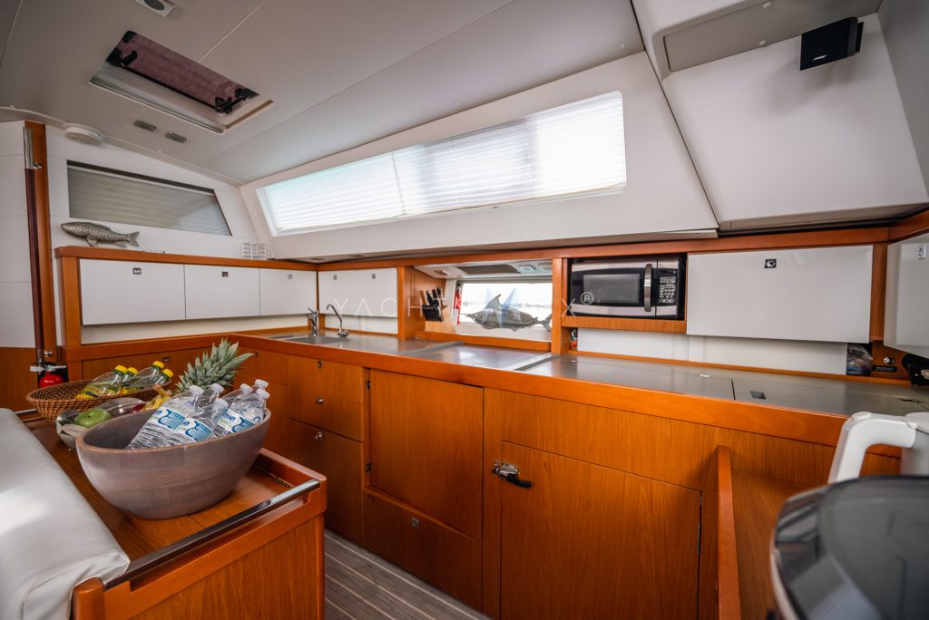 Beneteau 58 yacht charter La Paz - main salon and galley photo 02