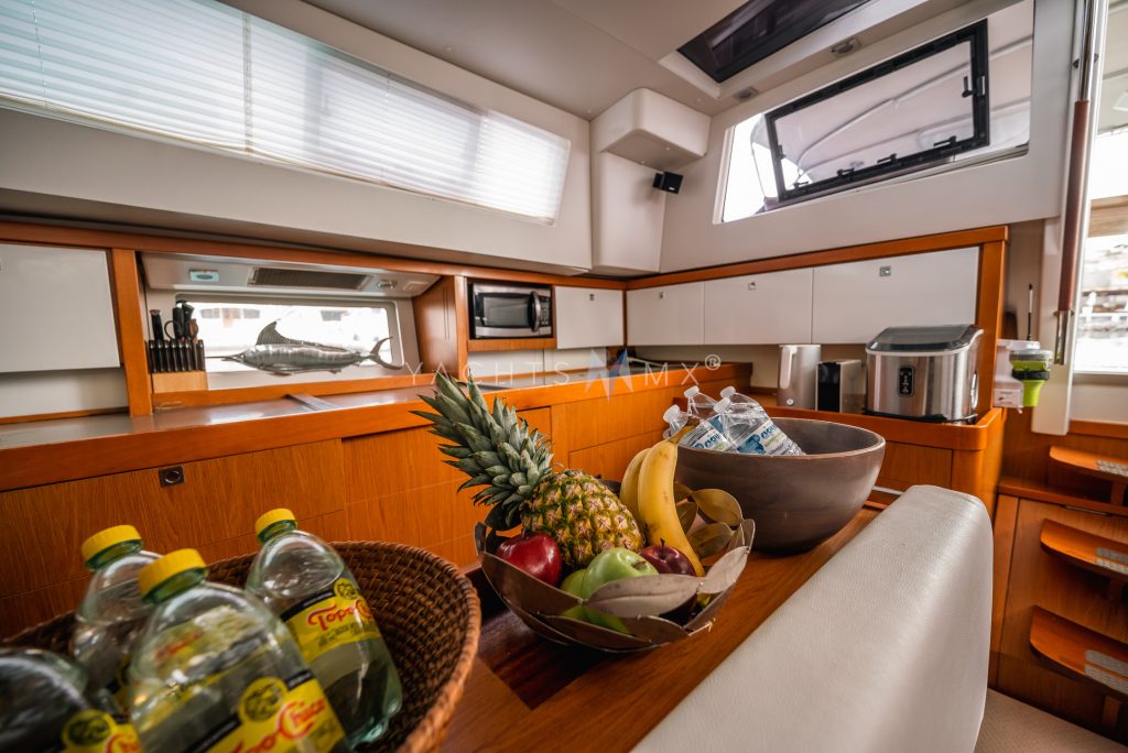 Beneteau 58 yacht charter La Paz - main salon and galley photo 05