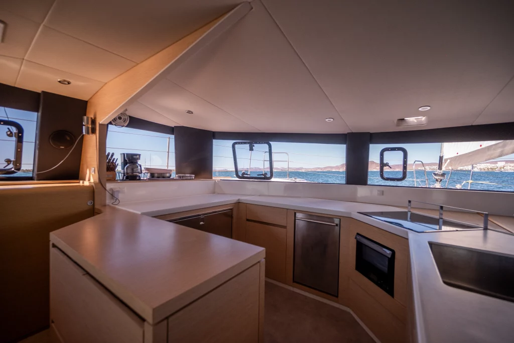 Neel 51 yacht charter La Paz - main salon and galley photo 01