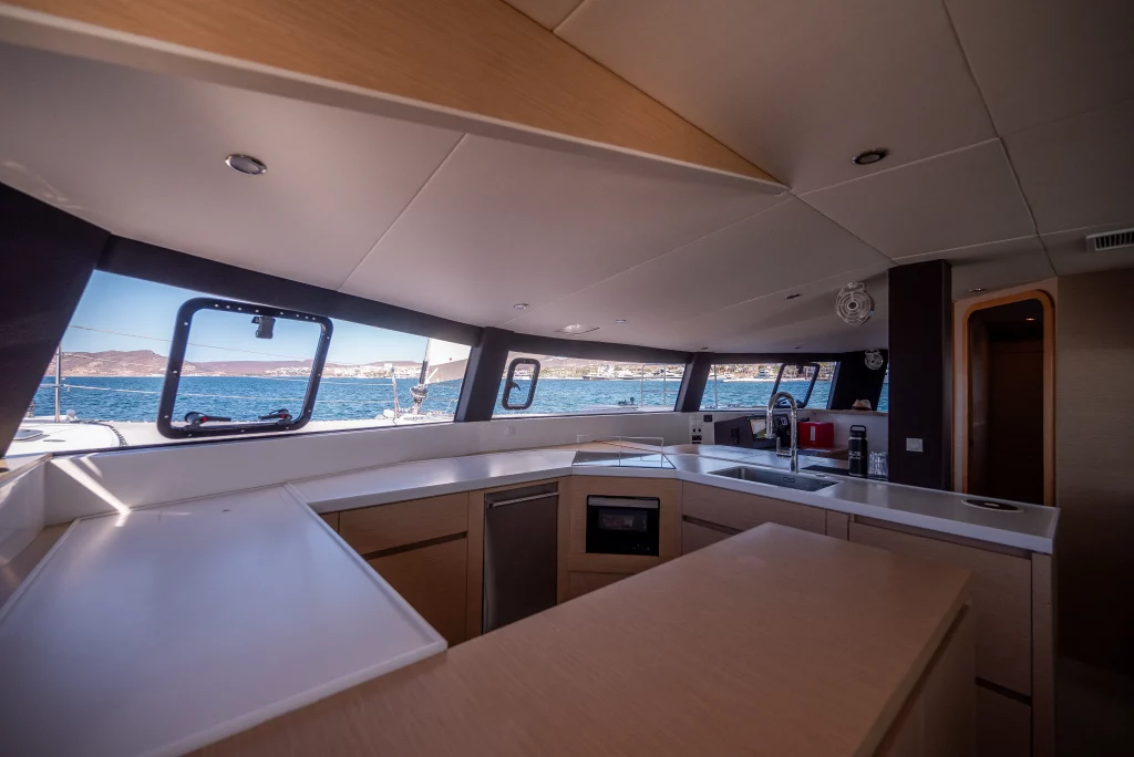 Neel 51 yacht charter La Paz - main salon and galley photo 02