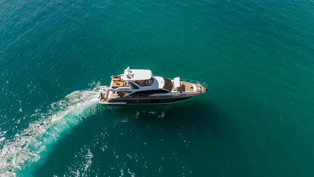 Aerial view of a luxury Azimut 66 yacht cruising the turquoise waters of Baja California Sur