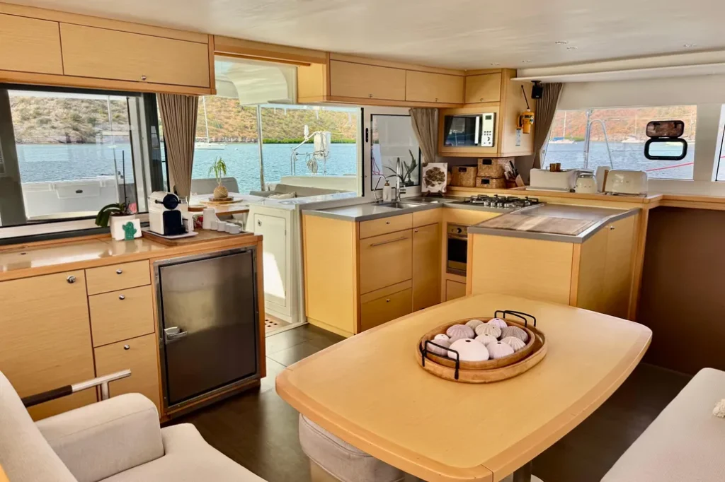 Lagoon 45 yacht charter La Paz - main salon and galley photo 04