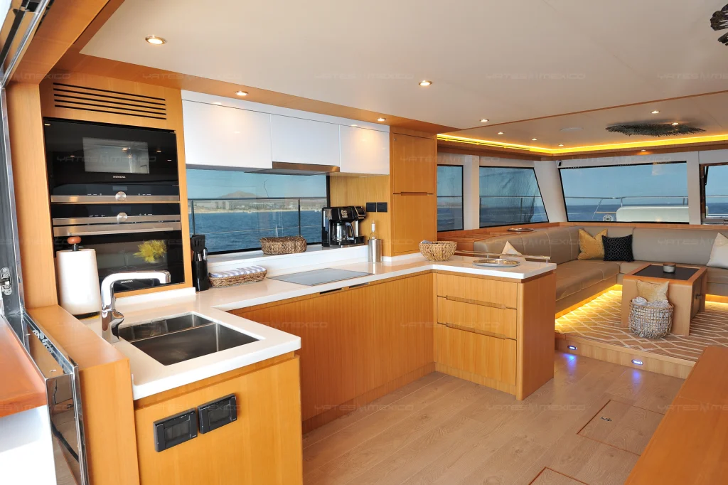 Iliad 60 yacht charter Cabo San Lucas - main salon and galley photo 02