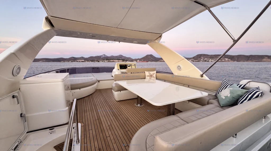 Ferretti 75 yacht charter La Paz - flybridge lounge and table with bay views