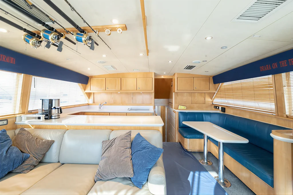 Bertram 54 yacht charter La Paz - dinette table set for lunch between fishing sessions