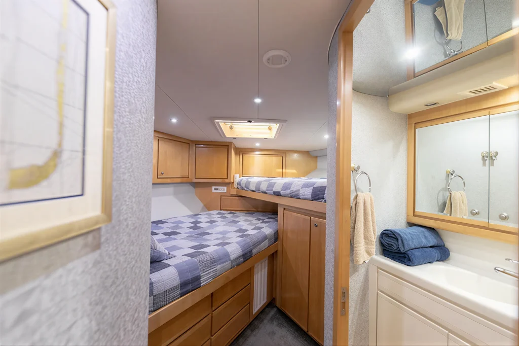 Bertram 54 yacht charter La Paz - bunk cabin with storage and reading lights