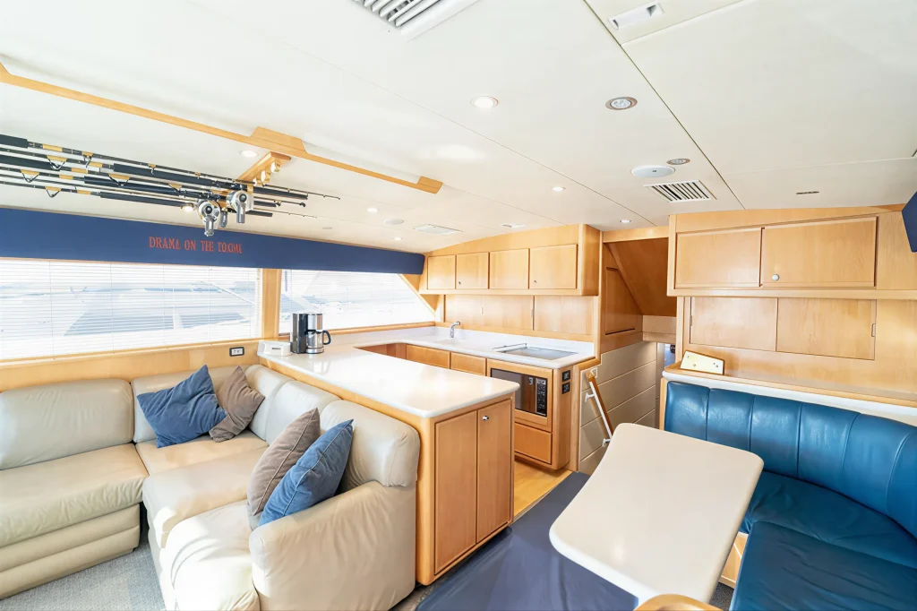 Bertram 54 yacht charter La Paz - salon seating with leather sofa and helm chair