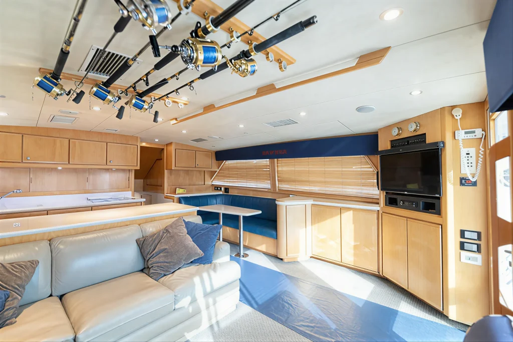 Bertram 54 yacht charter La Paz - air-conditioned salon with rod storage overhead and dinette
