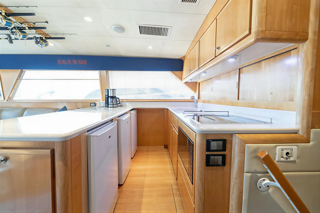 Bertram 54 yacht charter La Paz - full galley with teak joinery and sea view