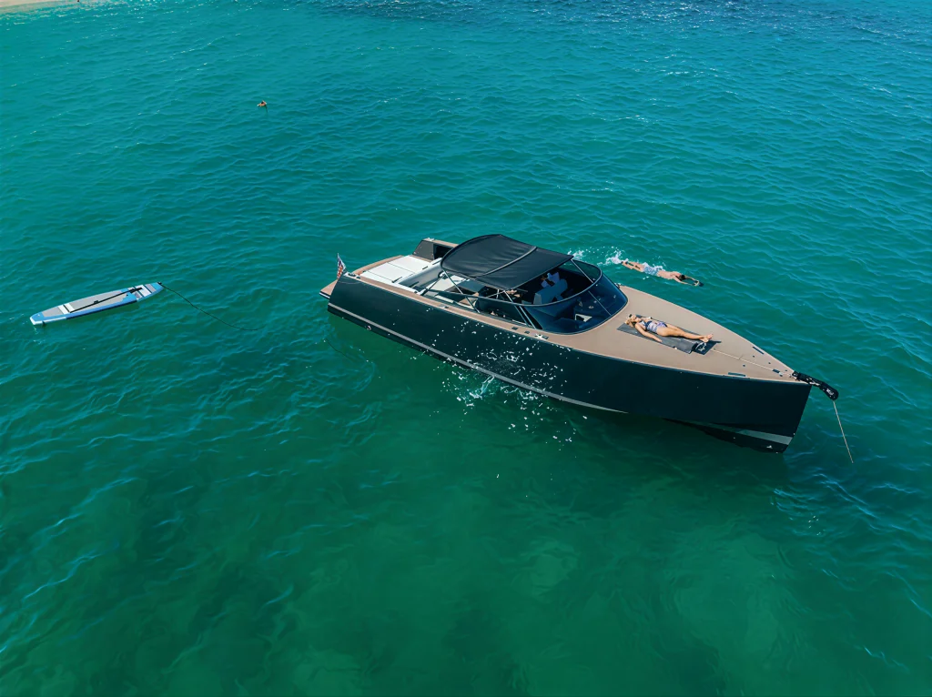 Aerial view of the VanDutch 42 anchored in turquoise water with the paddle board out