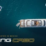 Aerial view of a yacht cruising and leaving a wake off Cabo San Lucas