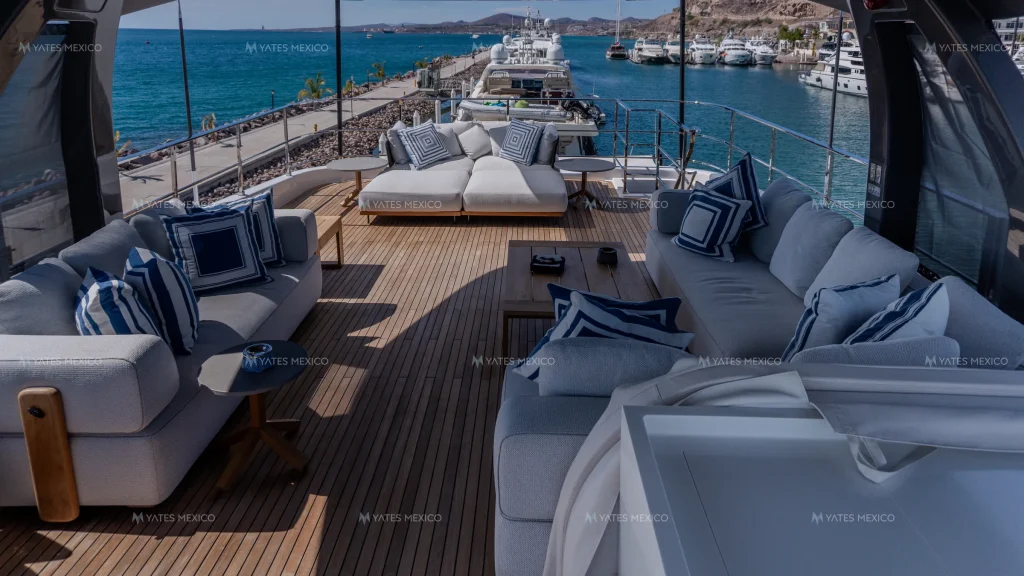 Custom Line 110 yacht charter La Paz - flybridge lounge in teak and navy