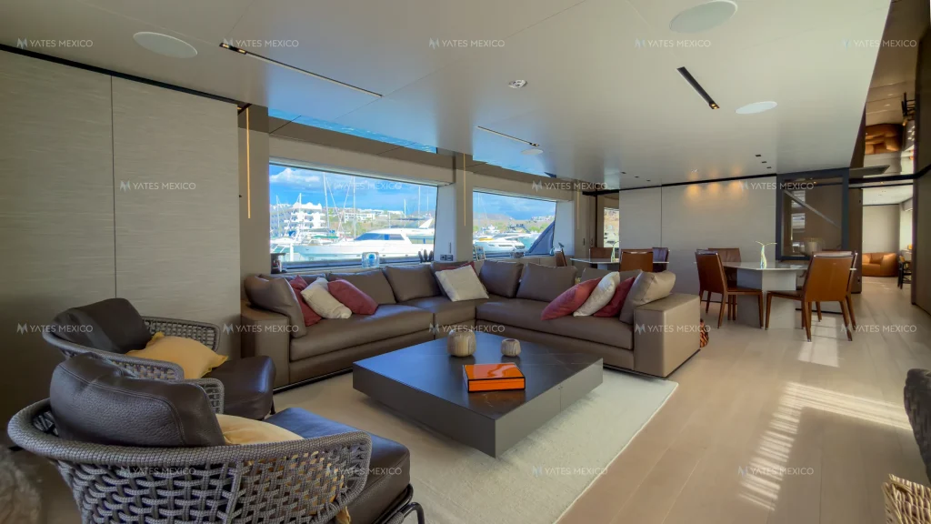 Custom Line 110 yacht charter La Paz - lounge seating and formal dining table