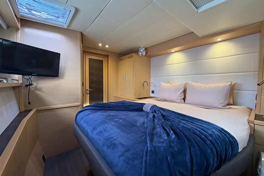 Master cabin with TV aboard the Lagoon 63 charter catamaran in La Paz