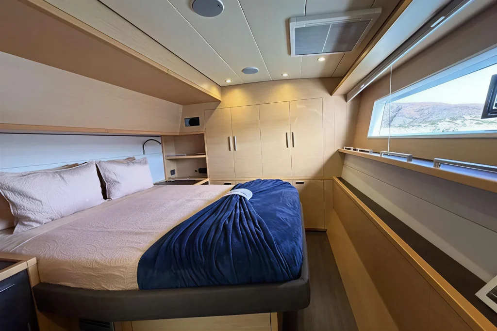 Guest cabin with hull window on the Lagoon 63 catamaran, Sea of Cortez charter