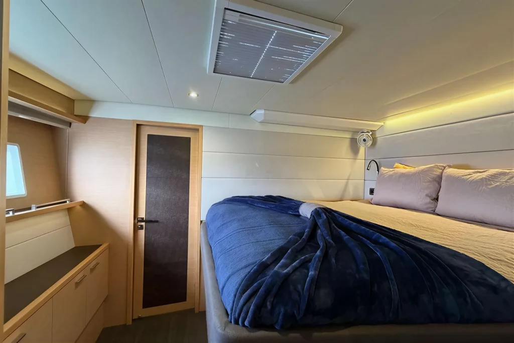 Guest cabin and en-suite entry aboard the Lagoon 63 charter catamaran