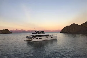 Lagoon 63 catamaran anchored at sunset off Isla Espiritu Santo, La Paz