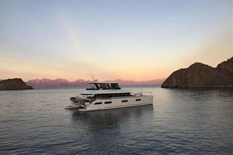 Lagoon 63 catamaran anchored at sunset off Isla Espiritu Santo, La Paz