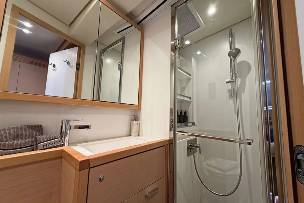 En-suite vanity and shower aboard the Lagoon 63 charter catamaran