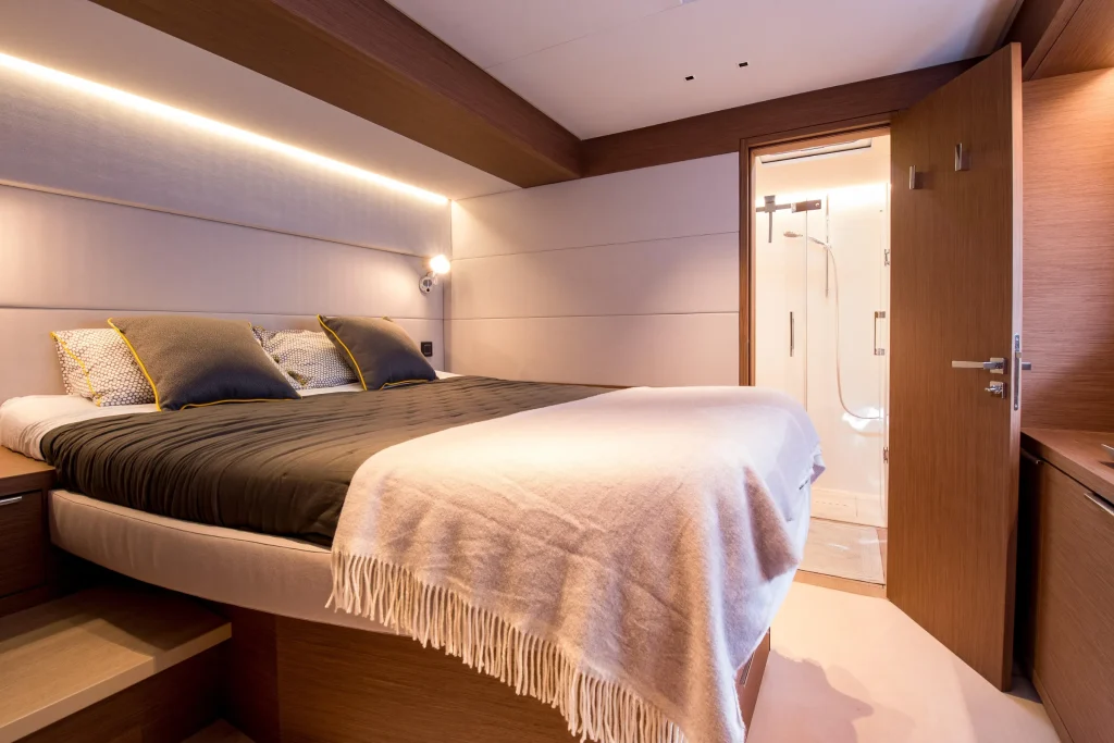 Guest cabin with double berth and ensuite door on the Lagoon 67