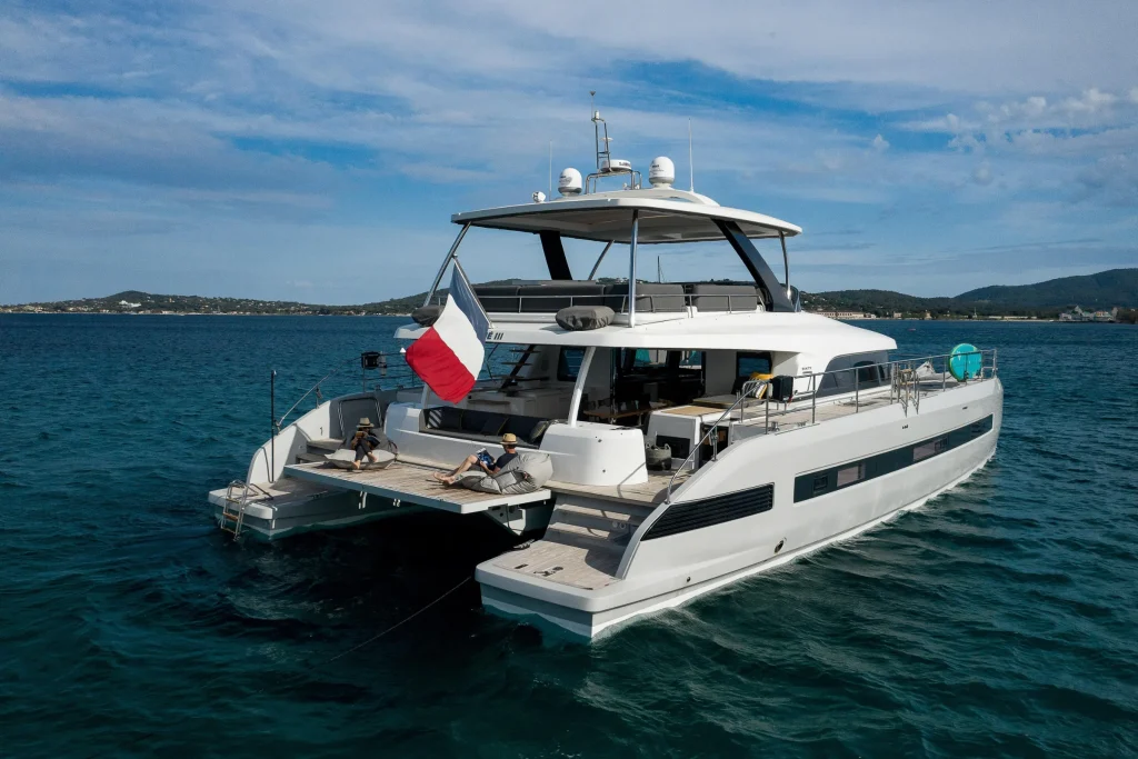 Bow view of the Lagoon 67 charter catamaran on calm turquoise water
