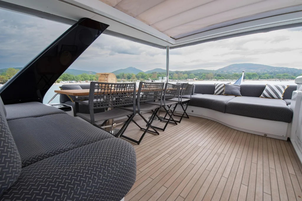 Shaded flybridge lounge with bar seating aboard the Lagoon 67