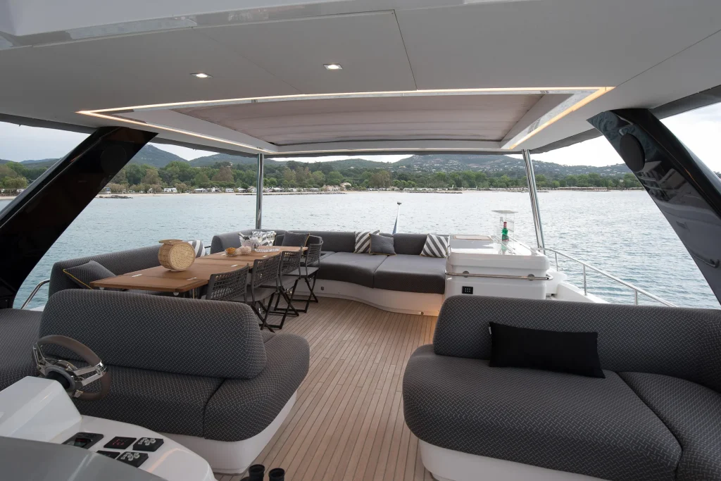 Wraparound flybridge sofa with open sea views on the Lagoon 67