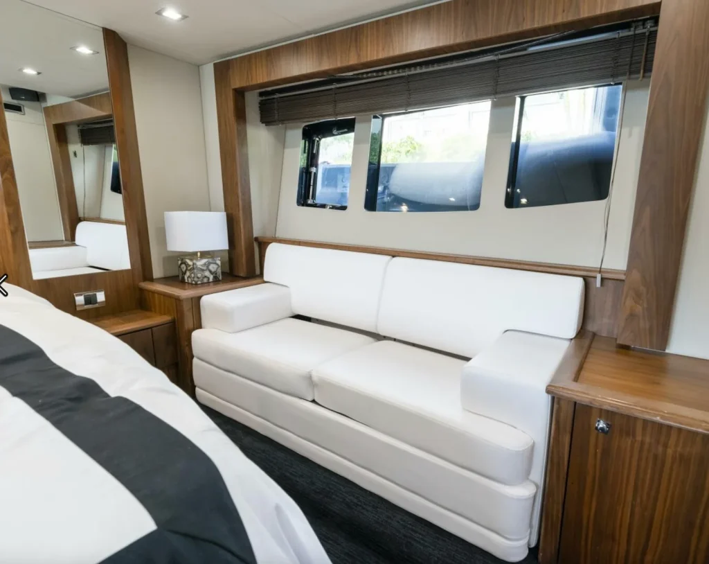 Sunseeker 64 yacht charter La Paz - master stateroom sofa and hull windows
