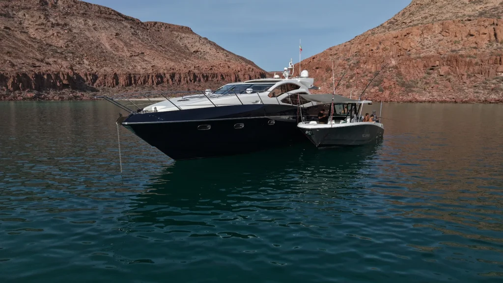 Sunseeker 64 yacht charter La Paz - with tender between the island cliffs